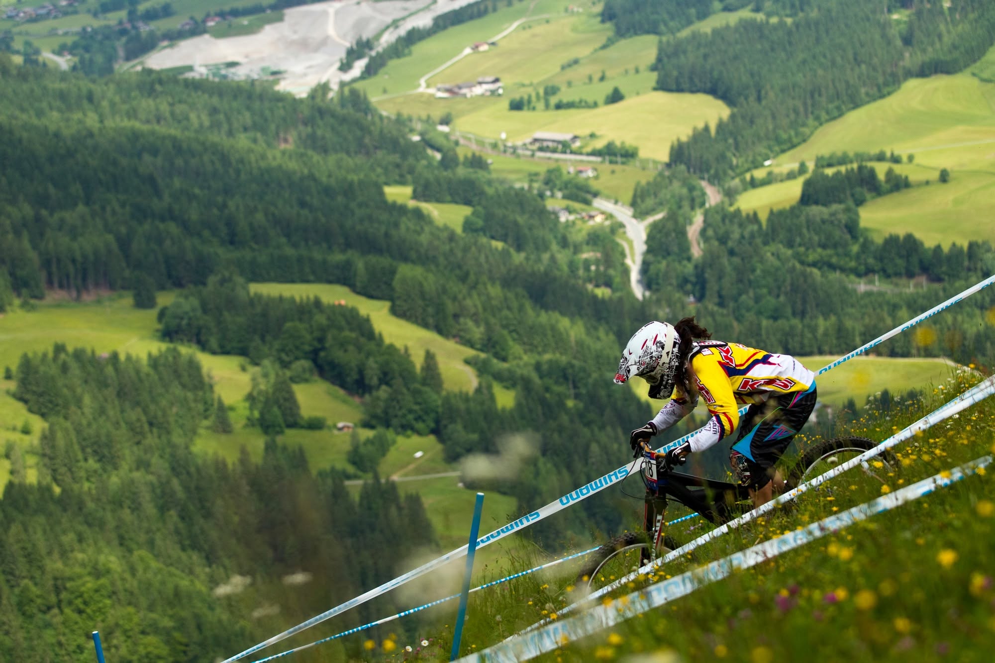 Melissa Buhl racing downhill on a mountain bike